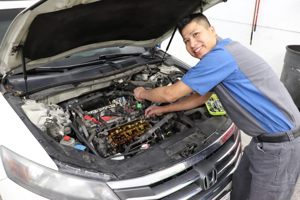 Juan performing engine repairs on 2012 honda accord
